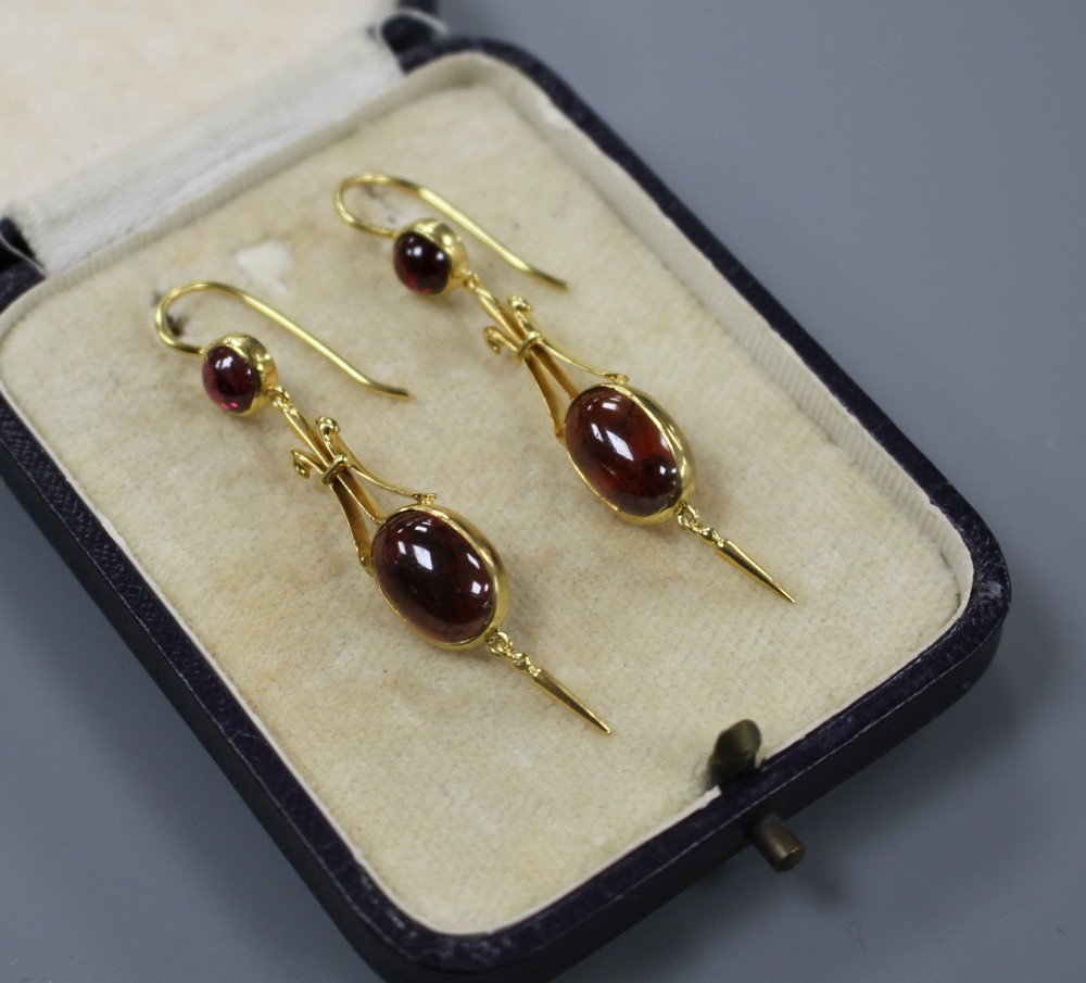 A pair of Victorian style yellow metal and cabochon garnet set drop earrings, overall 50mm, gross weight 5.1 grams.